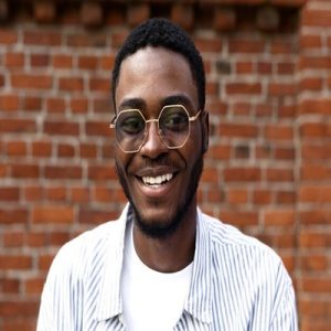 close up smiley man with glasses_23 2149009406 1 300x300 1